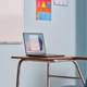 A photo of the laptop on a classroom desk